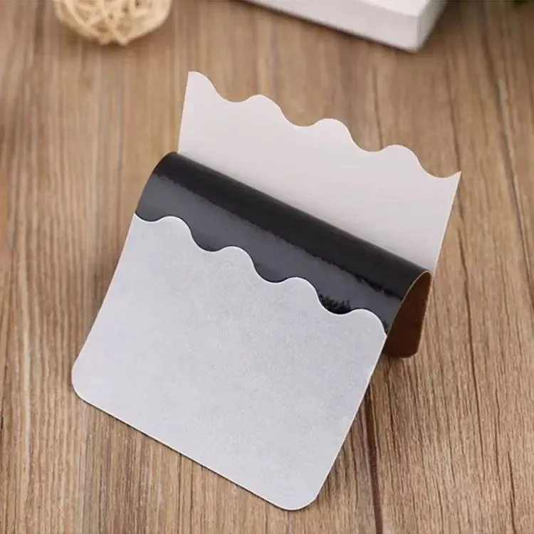 Single warming herbal body patch on a wood surface
